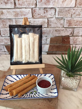 Load image into Gallery viewer, Vegan cheese rolled in a crispy lumpia springroll wrapper. 
